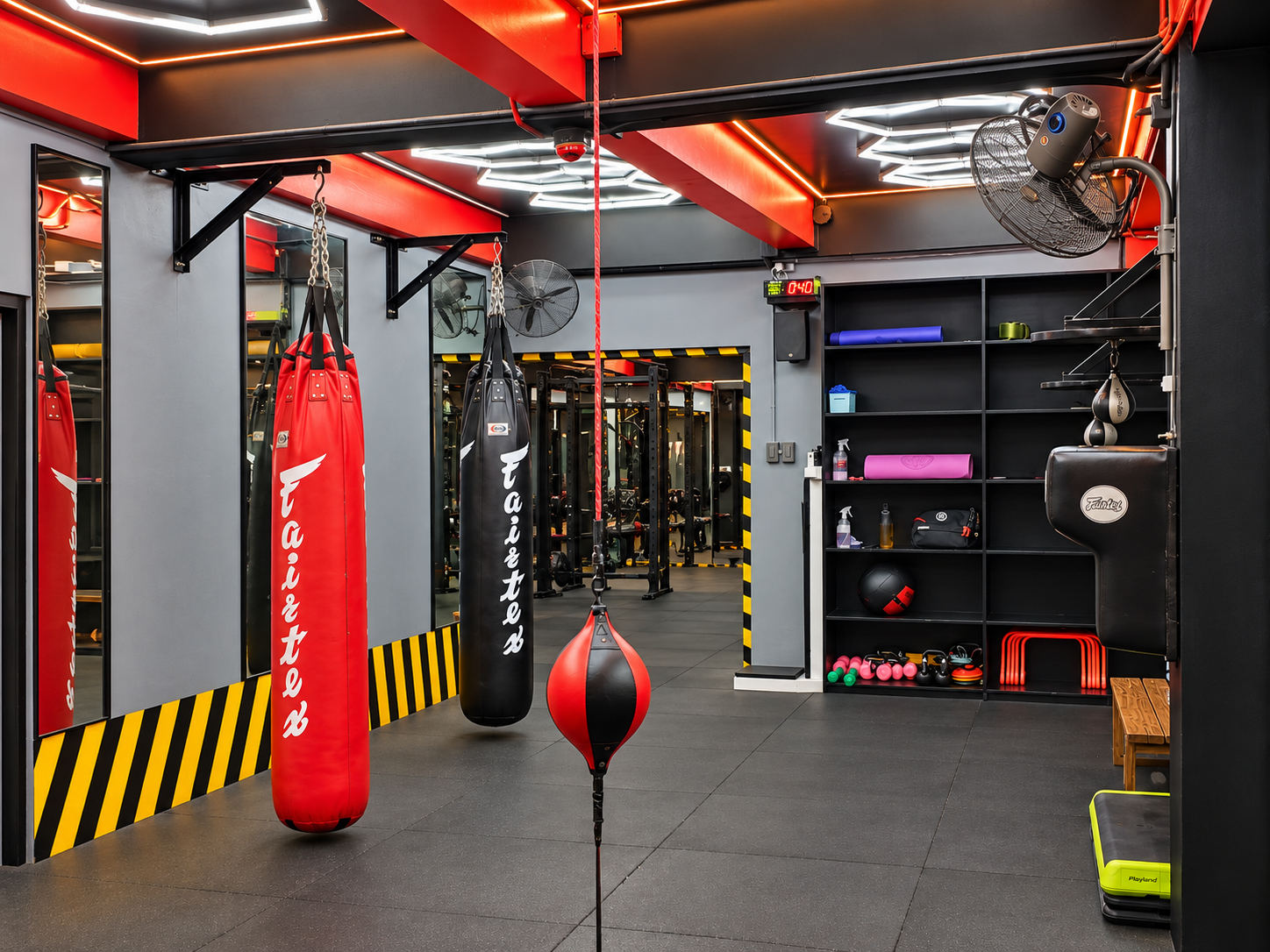 Two people practicing boxing in a ring.